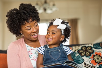 A mother and daughter reading together