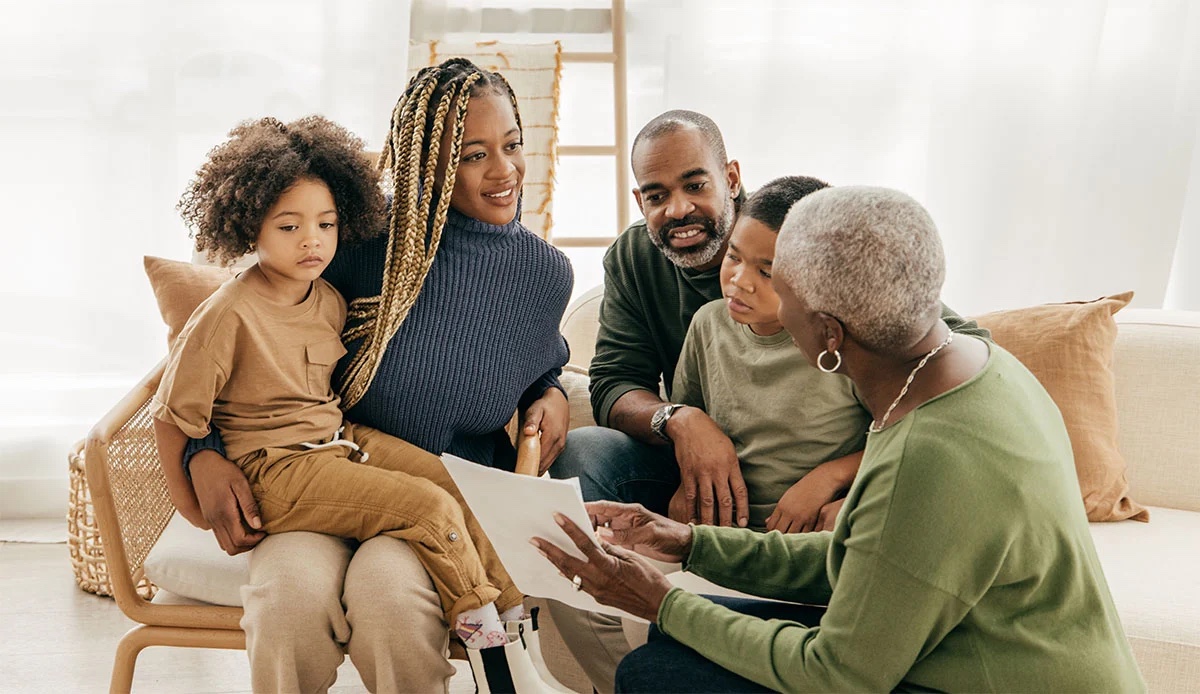 A multigenerational family reviewing documents together